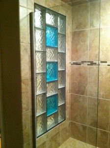 a glass block shower door in a bathroom