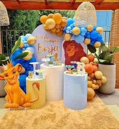 the lion king birthday party is set up with balloons, decorations and other items for guests to enjoy