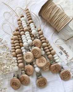 several wooden beads and string on a table