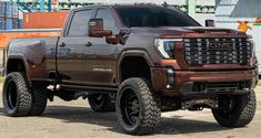 a brown truck parked in front of a building