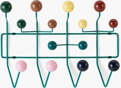 a rack with several different colored balls on it