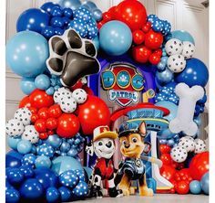 the balloon arch is decorated with balloons and paw patrol characters