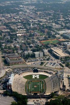 an aerial view of a football stadium in the city