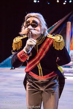 a man dressed as a nutcracker with glasses and a moustache on his face