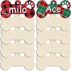 two dog bone shaped name tags with plaid and paw prints on them, one is white the other is red and green