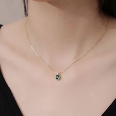 This exquisite pendant necklace showcases a brilliant emerald in a classic solitaire setting, radiating a lush green hue. Its elegant simplicity makes it a standout piece, perfect for enhancing any neckline with a touch of refined sophistication. Elegant Emerald Pendant Necklace With Clavicle Chain, Elegant Emerald Necklace With Round Pendant, Elegant Emerald Round Pendant Necklace, Elegant Emerald Birthstone Necklace With Round Pendant, Elegant Green Solitaire Necklace For May Birthstone, Elegant Emerald Pendant Birthstone Necklace, Elegant Green Solitaire Necklace, Elegant Green Pendant Necklace, Elegant Emerald Necklace With Round Pendant For Gift