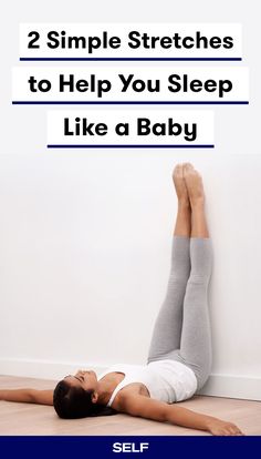 a woman laying on the floor with her feet up and arms behind her head while she is