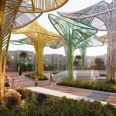 an artist's rendering of a park with trees, fountains and people walking around