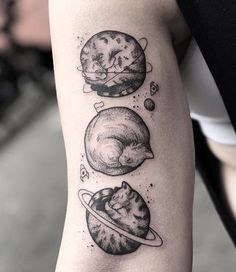 an arm with three different planets on it