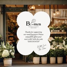 a flower shop with flowers in front of it and a sign that says, bummen thanks for supporting our small business please everyone