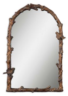 a mirror that is made out of wood and has branches on the frame, as well as