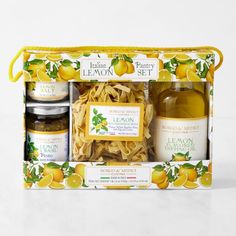 the lemon party gift set includes two jars and three different types of food in it