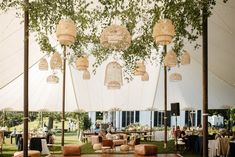 tables and chairs are set up under the tent