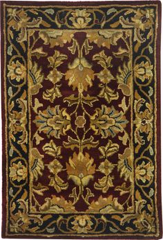 a red and gold rug with an ornate design on the center, surrounded by leaves