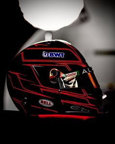 a helmet is lit up in the dark