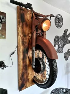 a motorcycle mounted to the side of a wall