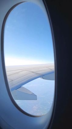 an airplane window looking out on the wing