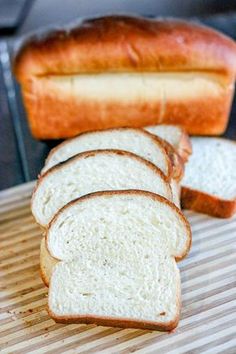 slices of bread sitting on top of a cutting board