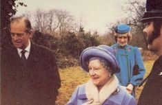 an old woman in a blue hat and coat talking to two men