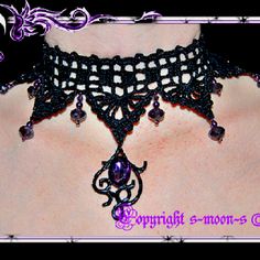 the back of a woman's neck wearing a black choker with purple beads