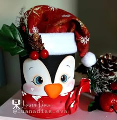 the penguin is wearing a santa claus hat