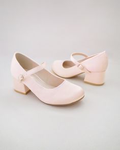 This flower girls satin block heels are charming and elegant shoes designed for little princess for birthday party, holiday party, wedding party, flower girls, quinceanera shoes, and other special occasions. The satin material adds a sophistication to the overall look, making them perfect for formal occasions.DETAILS:HEEL HEIGHT: 2 inchesUPPER: Synthetic upper and liningMATERIALS: Manmade outsoleORIGIN: Imported Quinceanera Shoes, Kids Heels, Flower Girl Shoes, Bridal Flats, Girls Heels, Wedding Guest Shoes, Glitter Shoes, Elegant Shoes, Satin Material