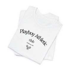 Step into the world of retro chic with our Playboy Athletic Club shirt, a fusion of vintage allure and timeless style. Crafted from premium materials, this shirt exudes both comfort and sophistication, making it a staple piece for your wardrobe. Whether you're hitting the gym, lounging at home, or out on the town, this shirt effortlessly blends sporty elegance with vintage flair. Elevate your everyday attire and make a bold statement with this must-have addition to your collection. Join the excl Retro Sports Tops With Text Print, Classic White Sports T-shirt, Classic Cotton T-shirt For College, Vintage Sports Tops With Text Print, Vintage Sports Top With Text Print, White Branded T-shirt For College, Classic Crew Neck Sports Top, Classic Letter Print Tops For College, Classic White Tops For College