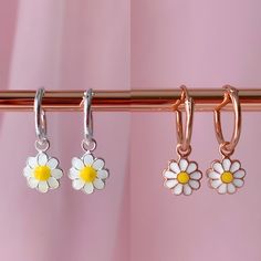 Get A Delicate And Delicate Look While Wearing This Cute Earrings. Also This Mini Hoops Are Perfect To Match Earrings With Your Little One. Silver Daisy Hoops Metal : 925 Sterling Silver. ( 925 Stamped ) Weight : 0,70g. Hoop Measurements : 1.2mm X 12mm Charm Measurements : 9mm X 9mm Materials : Enamel. Rose Gold Daisy Hoops Metal: 925 Sterling Silver. ( 925 Stamped ) Weight: 0,65g. Hoop Measurements: 1.2mm X 12mm Charm Measurements: 7mm X 7mm Materials: Enamel. Dainty Silver Flower Earrings For Everyday, Silver Dainty Flower Earrings For Everyday, Sterling Silver Flower Earrings For Summer, Sterling Silver Flower Earrings For Summer Gift, Silver Flower Earrings For Summer, Summer Flower Sterling Silver Earrings For Gift, Summer Flower Earrings In Sterling Silver For Gift, Silver Flower-shaped Metal Hoop Earrings, Silver Metal Flower Hoop Earrings