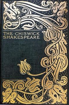 an old book with gold lettering on the front and green cover, sitting on a white surface