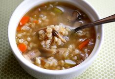 a white bowl filled with soup on top of a table