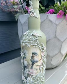 there is a vase with a bird on it