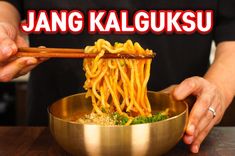 a person holding chopsticks over a bowl of noodles with the words'yang kalgusu'in front of them