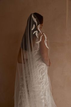 the back of a woman wearing a wedding veil