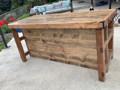 an outdoor bar made out of wooden planks