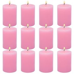 twelve pink candles are lined up in the shape of an eight - sided candle with one light on each side