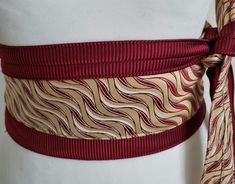 wine red and yellow cream swirls on these 2 vintage silk ties re-made into an unique and one of a kind  Japanese Obi belt. 1 size fits most: It wraps around your waist and you can tie it at the front, back or side as in the video. Very quirky and and versatile, you can dress it up or down, over a little black dress, over jeans and a top. This statement belt makes a perfect Christmas or Birthday present. Obi Kimono, Kimono Belt, Japanese Obi, Statement Belt, Obi Belt, Unique Accessories, Yellow Cream, Quirky Gifts, Suspender Belt