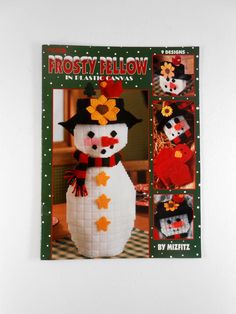 the front cover of frosty fellow magazine with four snowmen wearing hats and scarves