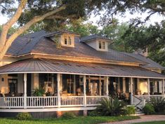 a large white house with porches on the front