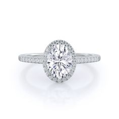 an oval cut diamond ring with pave set shoulders