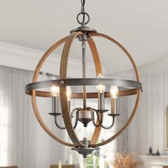 a wooden orb chandelier hanging over a dining room table