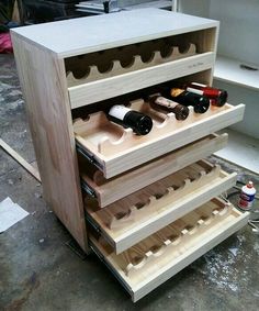 a wooden cabinet filled with lots of wine bottles