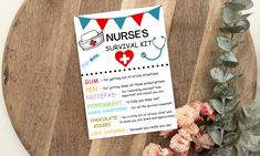 a nurse's survival kit on a wooden board next to flowers