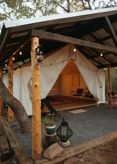 a tent is set up in the woods