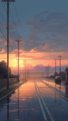 the sun is setting on an empty street with power lines and telephone poles in the background