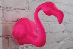 Bring a touch of tropics to your space with this 3D printed wall hanging flamingo! This vibrant pink bird features awesome 3D features, from the beak and eyes to the feathers. Crafted from eco-friendly, biodegradable PLA plastic and designed for easy wall hanging, this beautiful decor piece is sure to be a conversation starter. Perfect for adding a bit of whimsy to your living room, bedroom, or office! Flamingo Bedroom, Bedroom Adult, Easy Wall Hanging, Tiny Shop, Flamingo Decor, Beachy Decor, Adult Bedroom, Pink Bird, Pink Decor