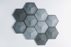 hexagon tiles arranged in the shape of an octagon on a white wall