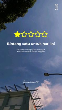 an advertisement with five stars on the side of a building in front of a blue sky