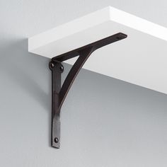 a shelf that has some metal brackets on it