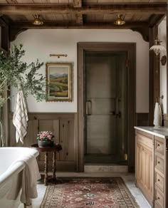 a bath room with a tub and a rug