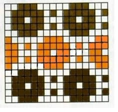 an orange and brown cat is in the middle of a cross stitch pattern with squares